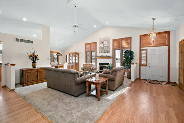 a living room with furniture and a fireplace