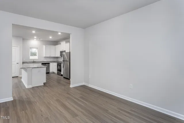 a view of kitchen with wooden floor