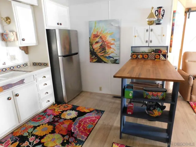 a bathroom with a toilet and a potted plant