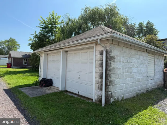 a view of a house with a parking space