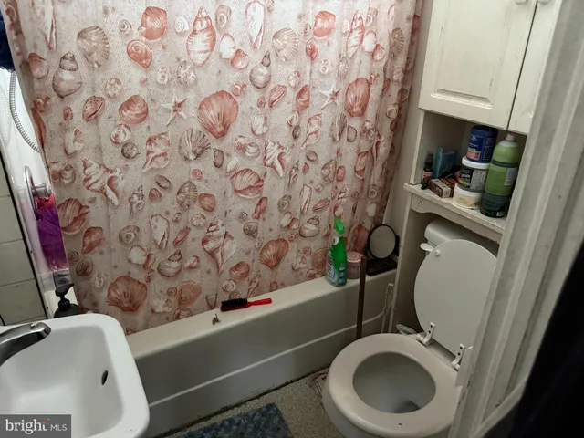 a kitchen with a refrigerator and a stove