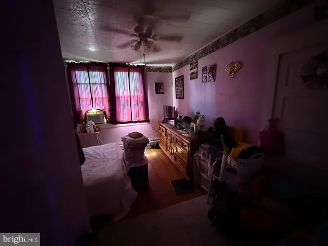 a view of a room with furniture and chandelier