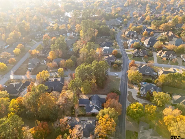 a view of a swimming pool with a yard