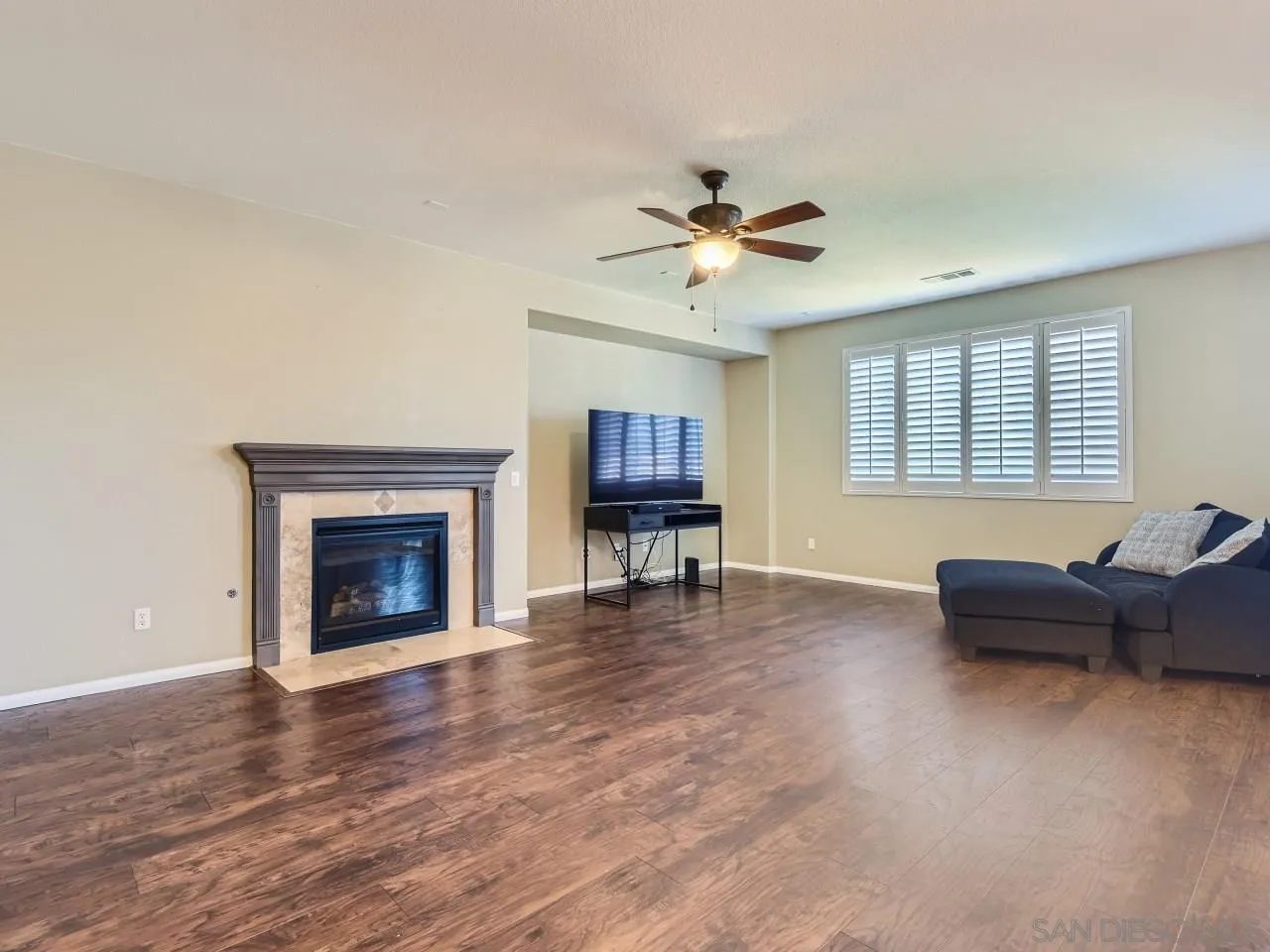 31183 Tiverton Road Menifee, CA 92584 - Photo 13 of 25 a living room with furniture and a fireplace