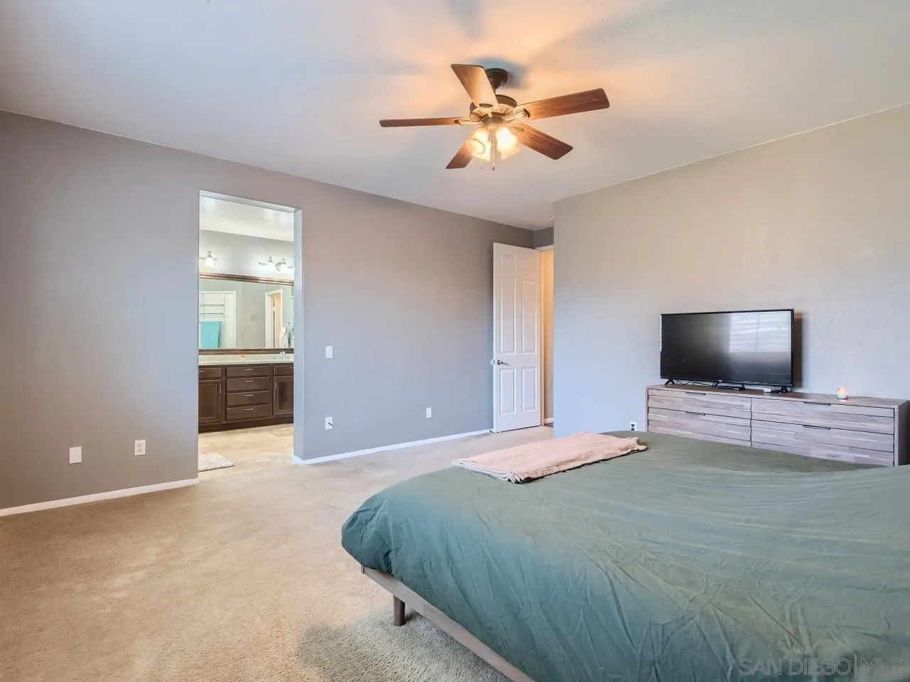 31183 Tiverton Road Menifee, CA 92584 - Photo 16 of 25 a bedroom with a bed and a flat screen tv