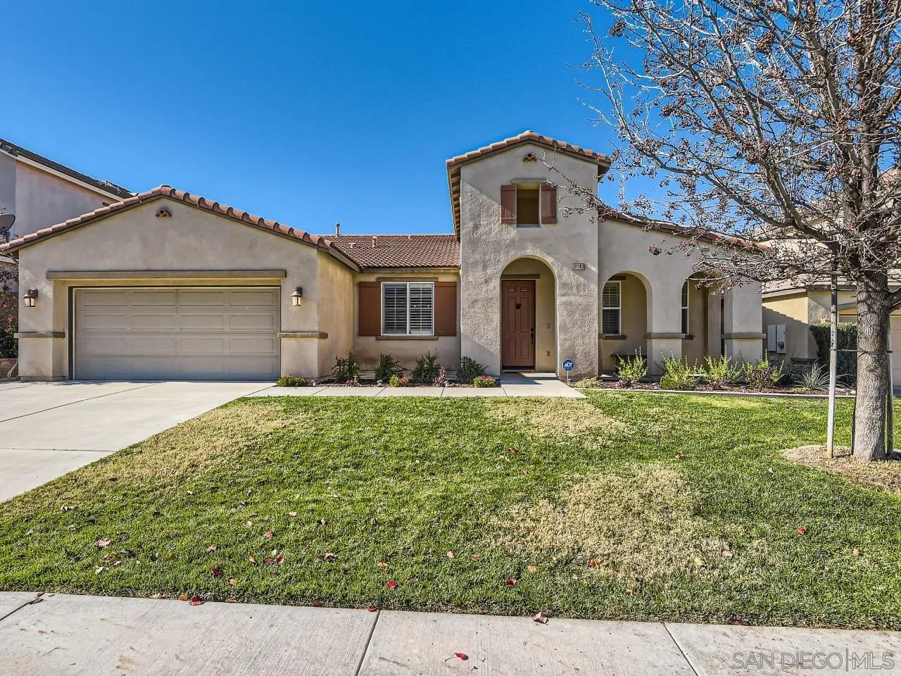 31183 Tiverton Road Menifee, CA 92584 - Photo 2 of 25 a front view of a house with a yard
