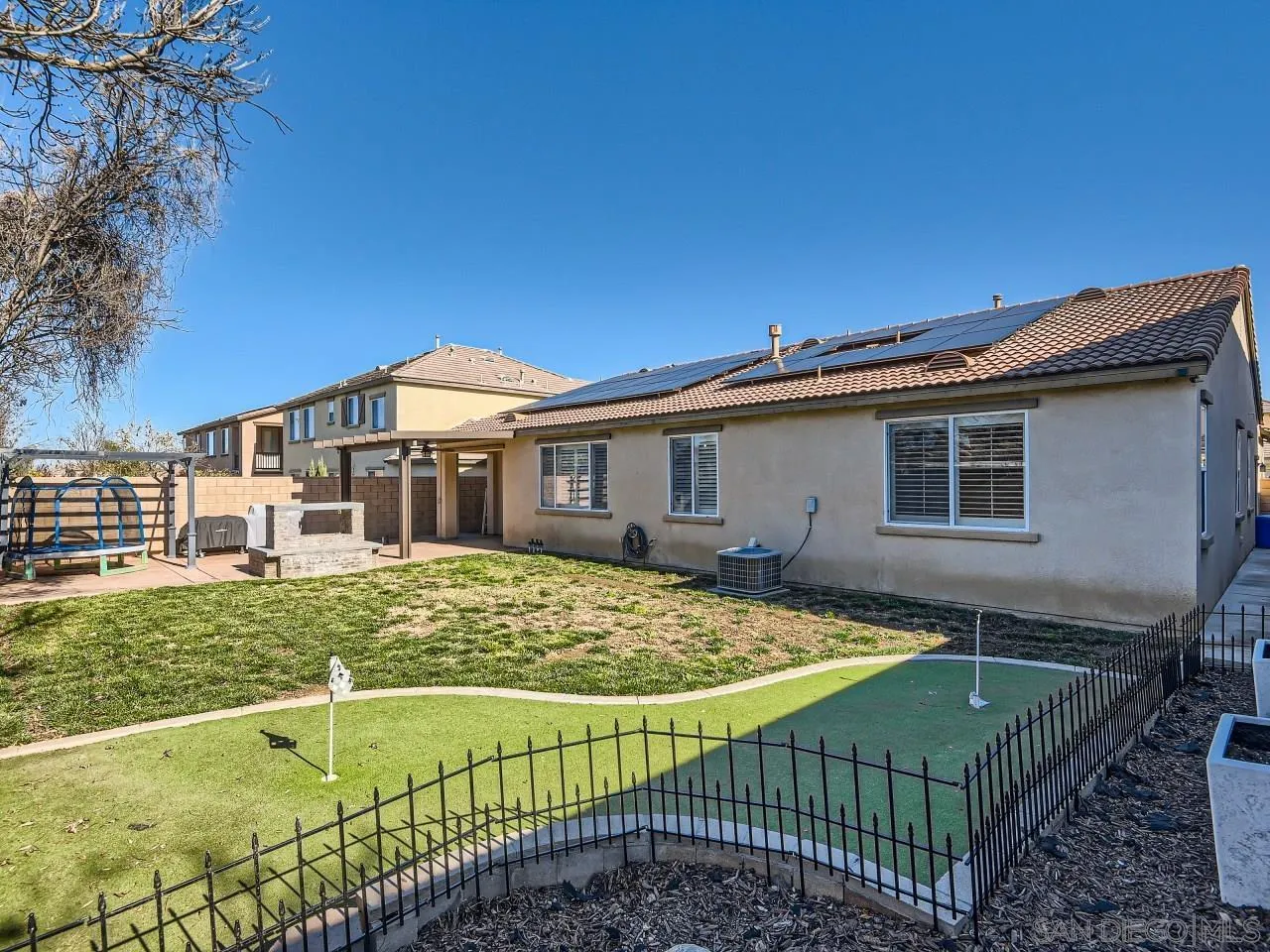 31183 Tiverton Road Menifee, CA 92584 - Photo 25 of 25 a view of a house with a swimming pool
