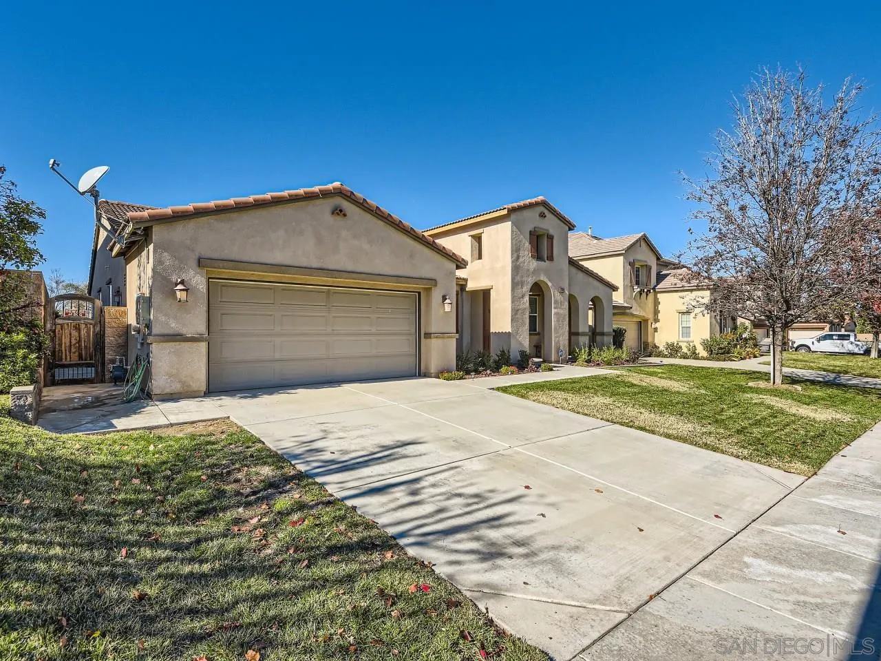 31183 Tiverton Road Menifee, CA 92584 - Photo 3 of 25 a front view of a house with a yard