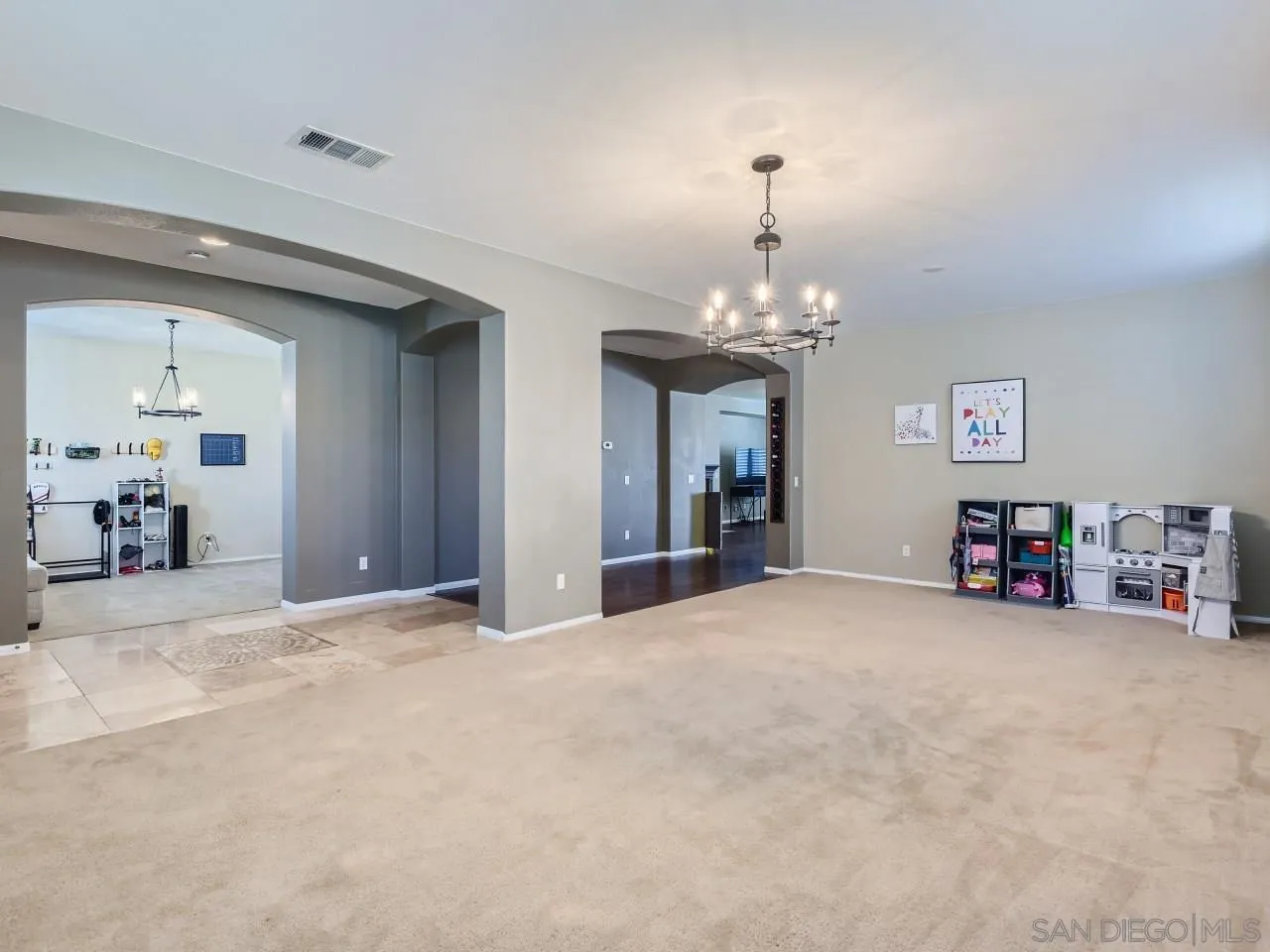 31183 Tiverton Road Menifee, CA 92584 - Photo 7 of 25 a view of a livingroom with a furniture and a chandelier