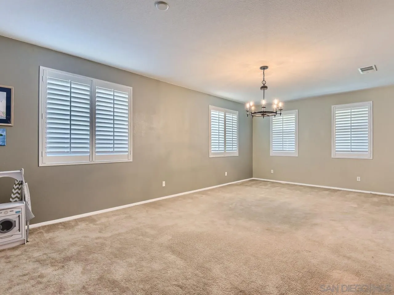 31183 Tiverton Road Menifee, CA 92584 - Photo 8 of 25 a view of an empty room with a window
