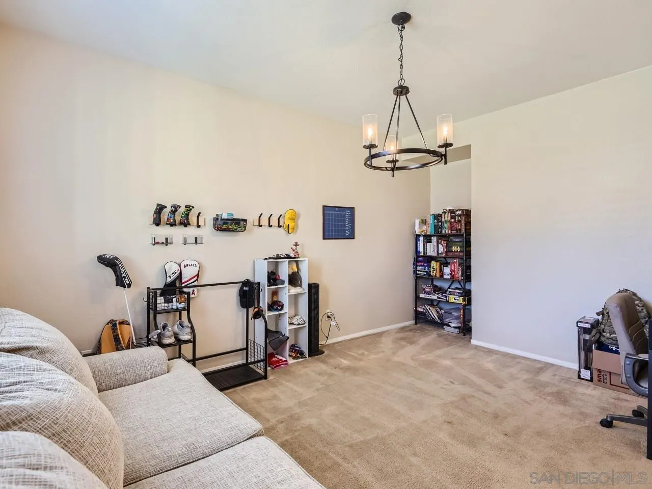 31183 Tiverton Road Menifee, CA 92584 - Photo 9 of 25 a living room with furniture and a chandelier