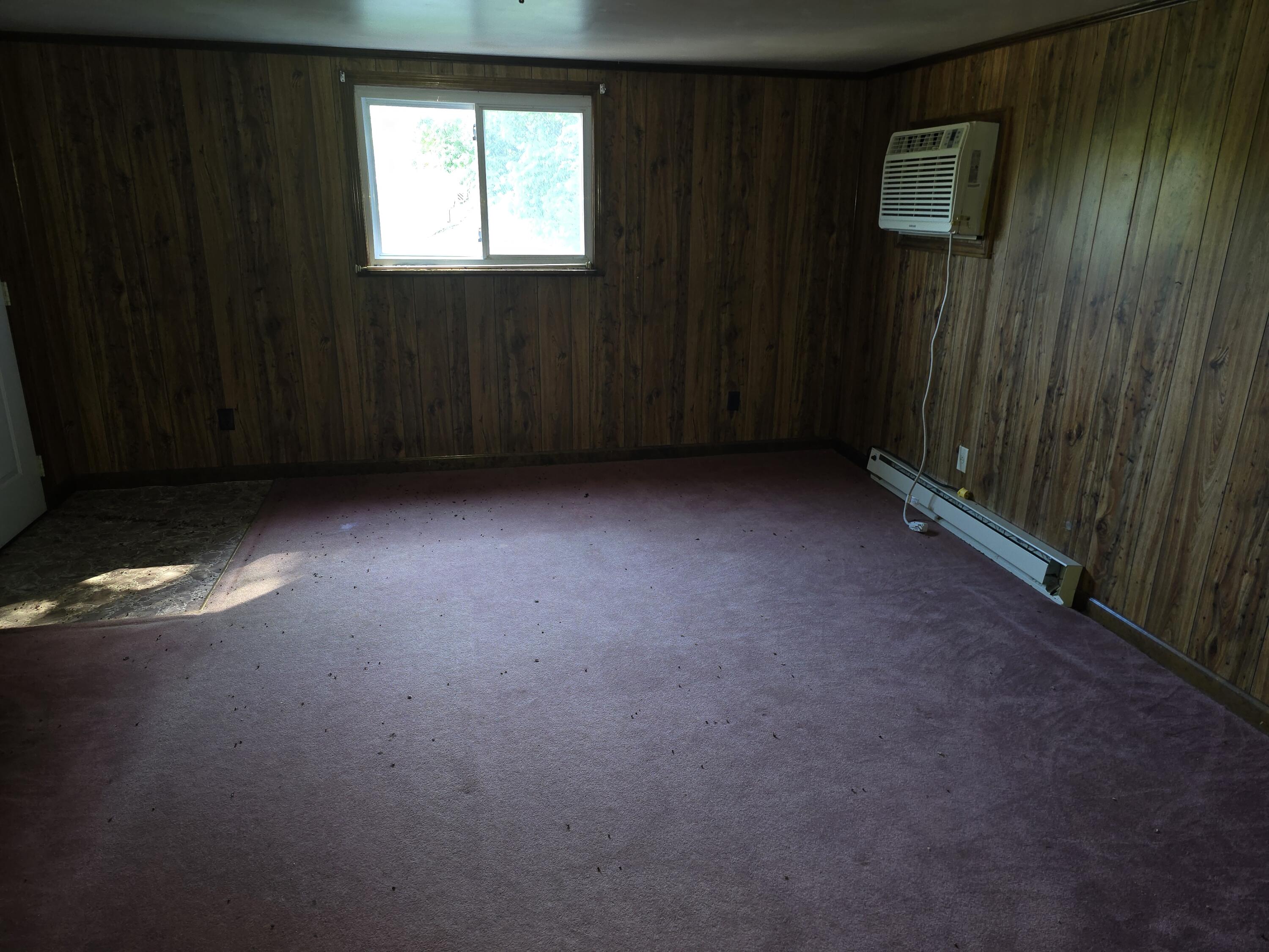415 Stock Pen Mountain Road Narrows, VA 24124 - Photo 7 of 16 an empty room with windows