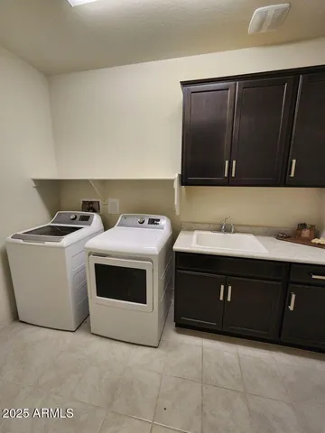 a utility room with washer and dryer
