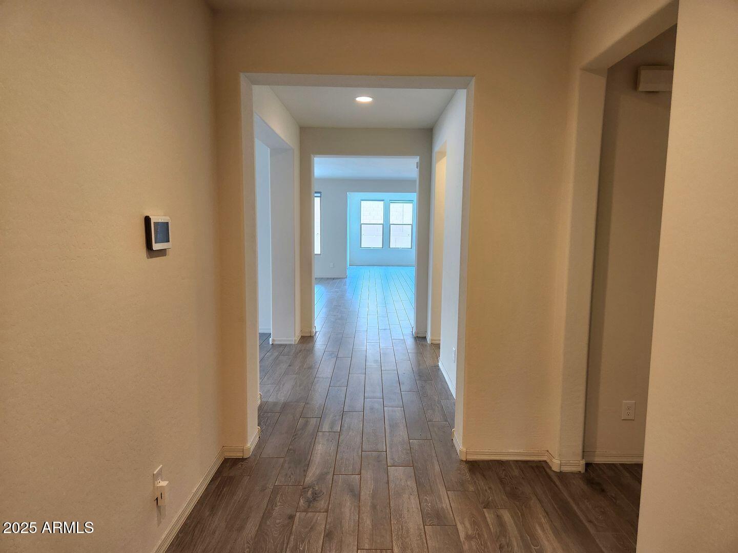 7198 West Bajada Road Peoria, AZ 85383 - Photo 2 of 36 a view of a hallway with wooden floor