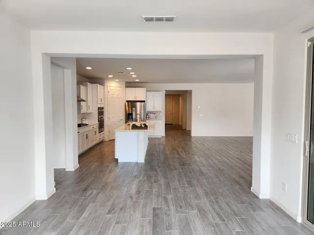 a view of kitchen and wooden floor