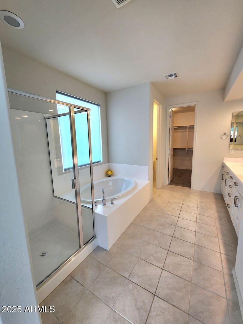 7198 West Bajada Road Peoria, AZ 85383 - Photo 29 of 36 a spacious bathroom with a tub and shower