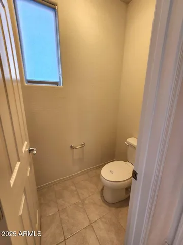 a bathroom with a toilet and a sink