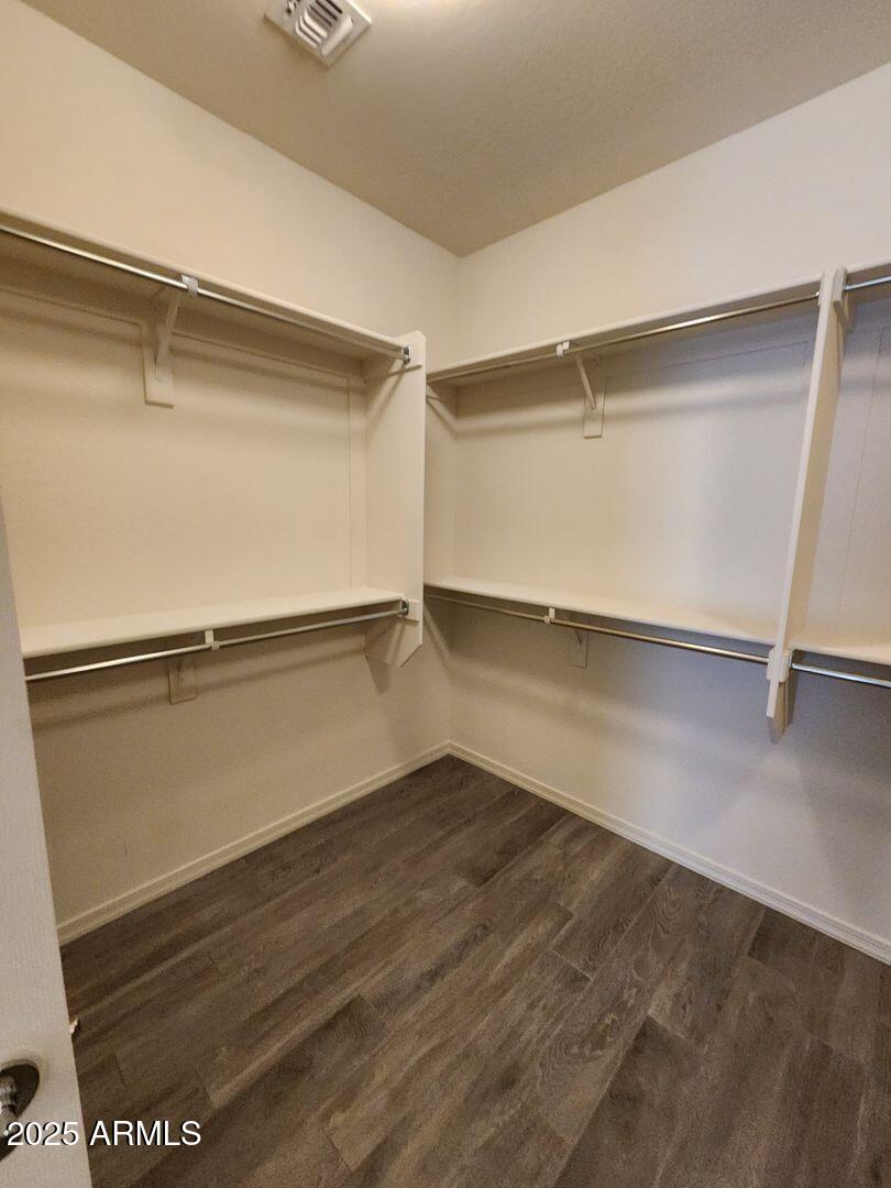 7198 West Bajada Road Peoria, AZ 85383 - Photo 32 of 36 a view of an empty room with wooden floor