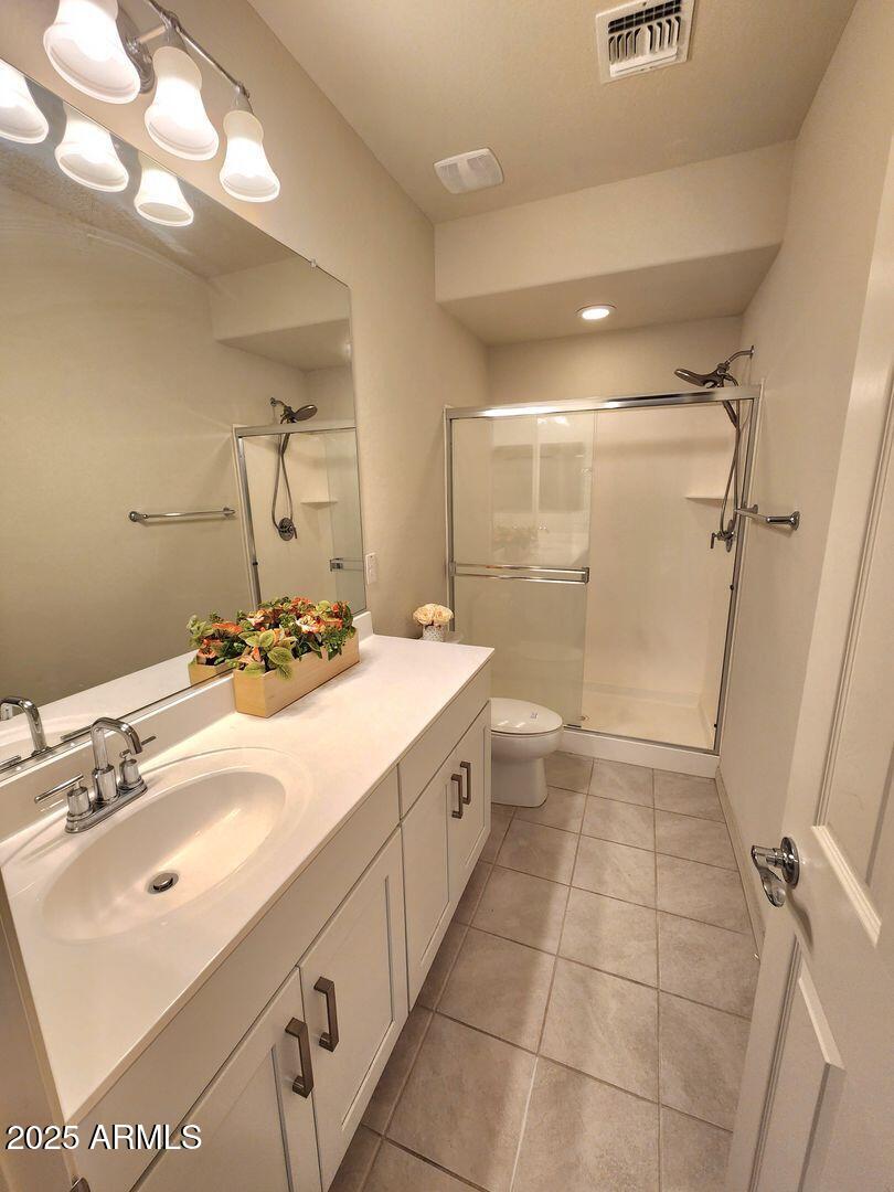 7198 West Bajada Road Peoria, AZ 85383 - Photo 7 of 36 a bathroom with a double vanity sink mirror and shower