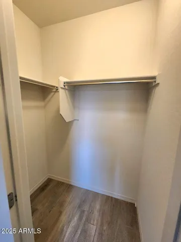 a view of an empty walk in closet