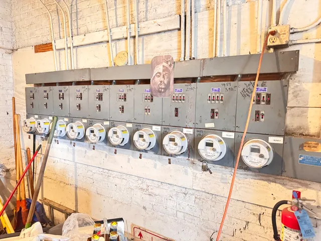 a room with water heater and a flat screen tv