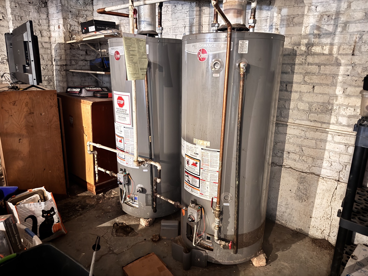 4459 West Jackson Boulevard Chicago, IL 60624 - Photo 14 of 14 a room with water heater and a flat screen tv