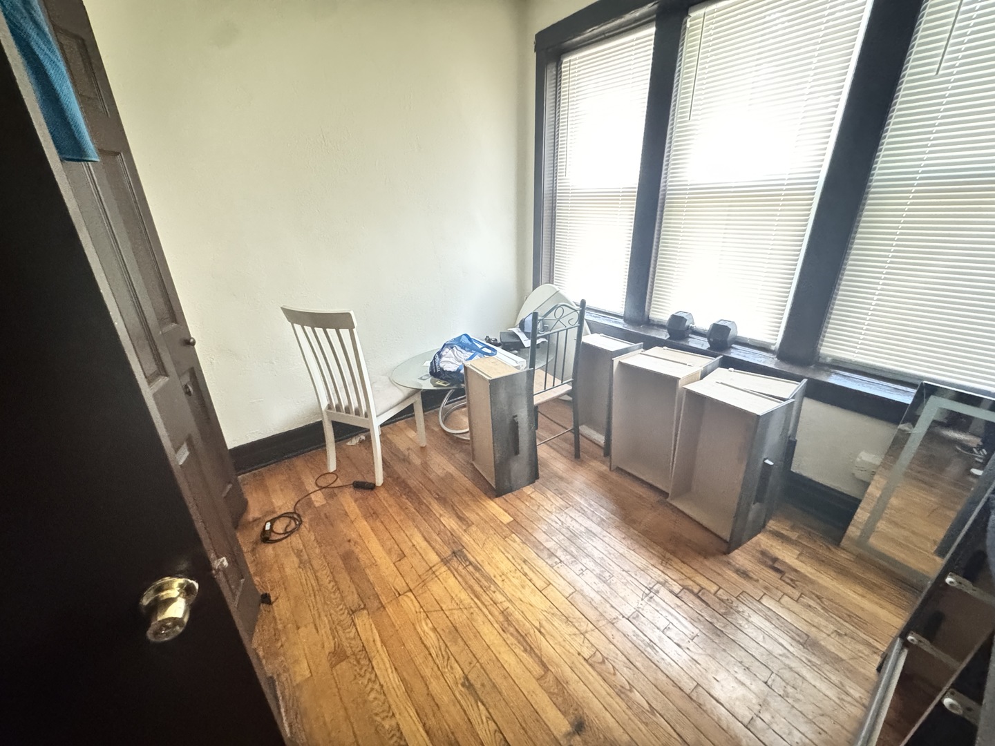 4459 West Jackson Boulevard Chicago, IL 60624 - Photo 6 of 14 a room with wooden floor and furniture