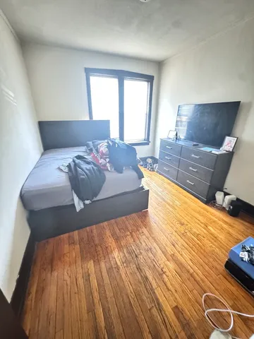 a living room with a bed and a couch
