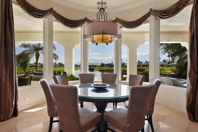 a bathroom with a granite countertop sink toilet a mirror and shower