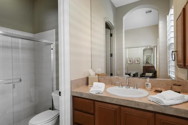 a living room with furniture a clock and a window