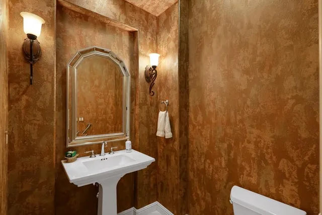 a spacious bedroom with a bed couch and a large window