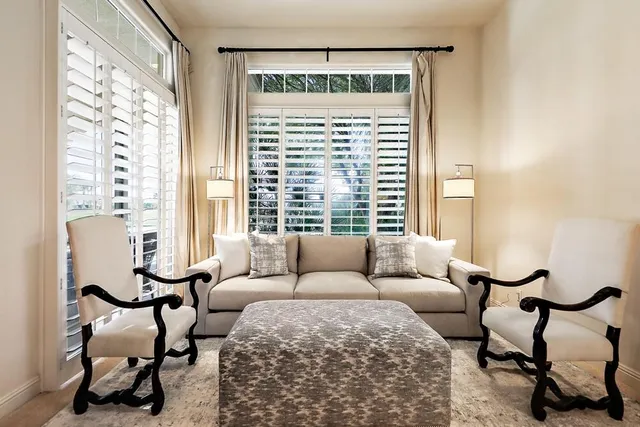 a large spacious bathroom with a granite countertop sink and mirror