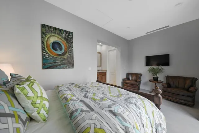 a bathroom with a sink and two mirror