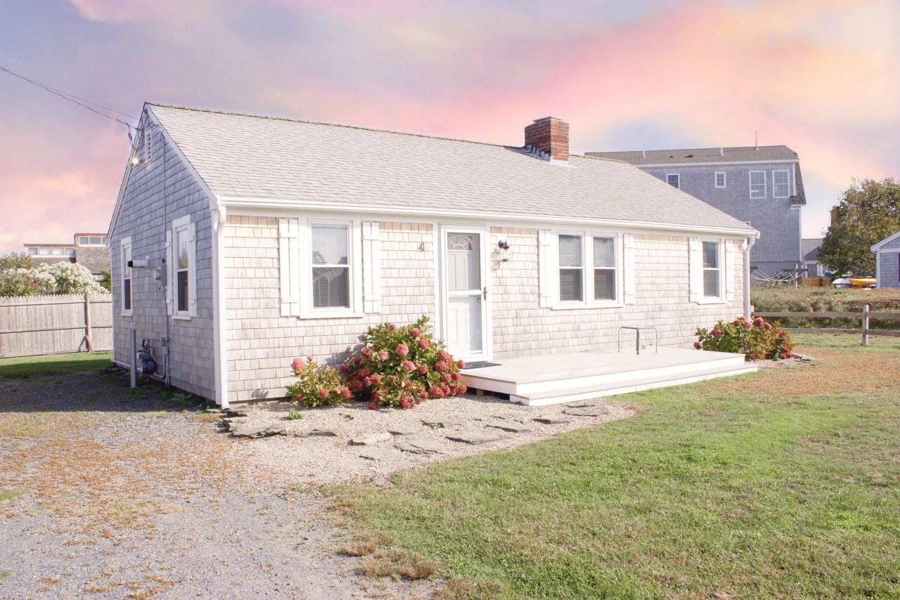 4 Beach Road West Dennis, MA 02670 - Photo 1 of 22 a front view of a house with a yard