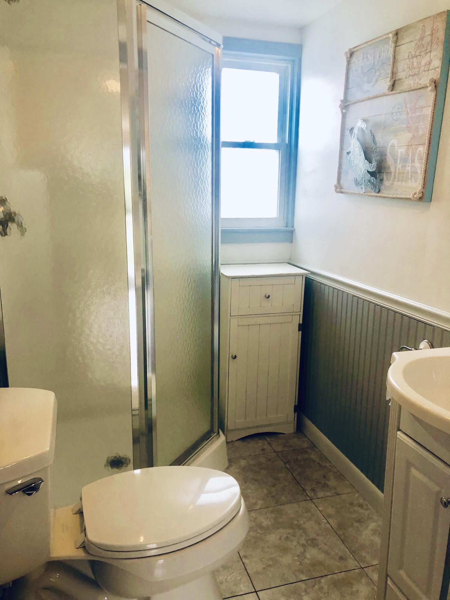 4 Beach Road West Dennis, MA 02670 - Photo 13 of 22 a bathroom with a sink toilet and shower