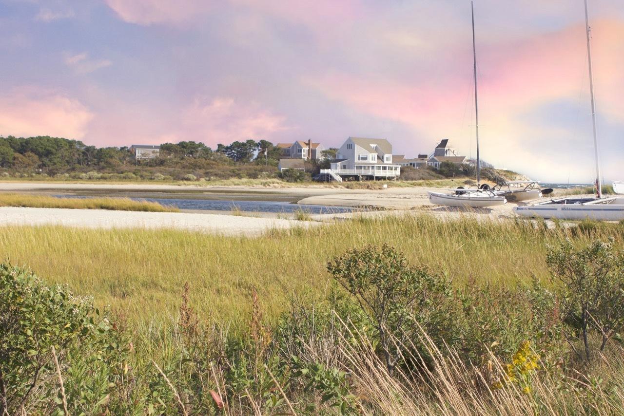 4 Beach Road West Dennis, MA 02670 - Photo 19 of 22 a view of a lake with a city