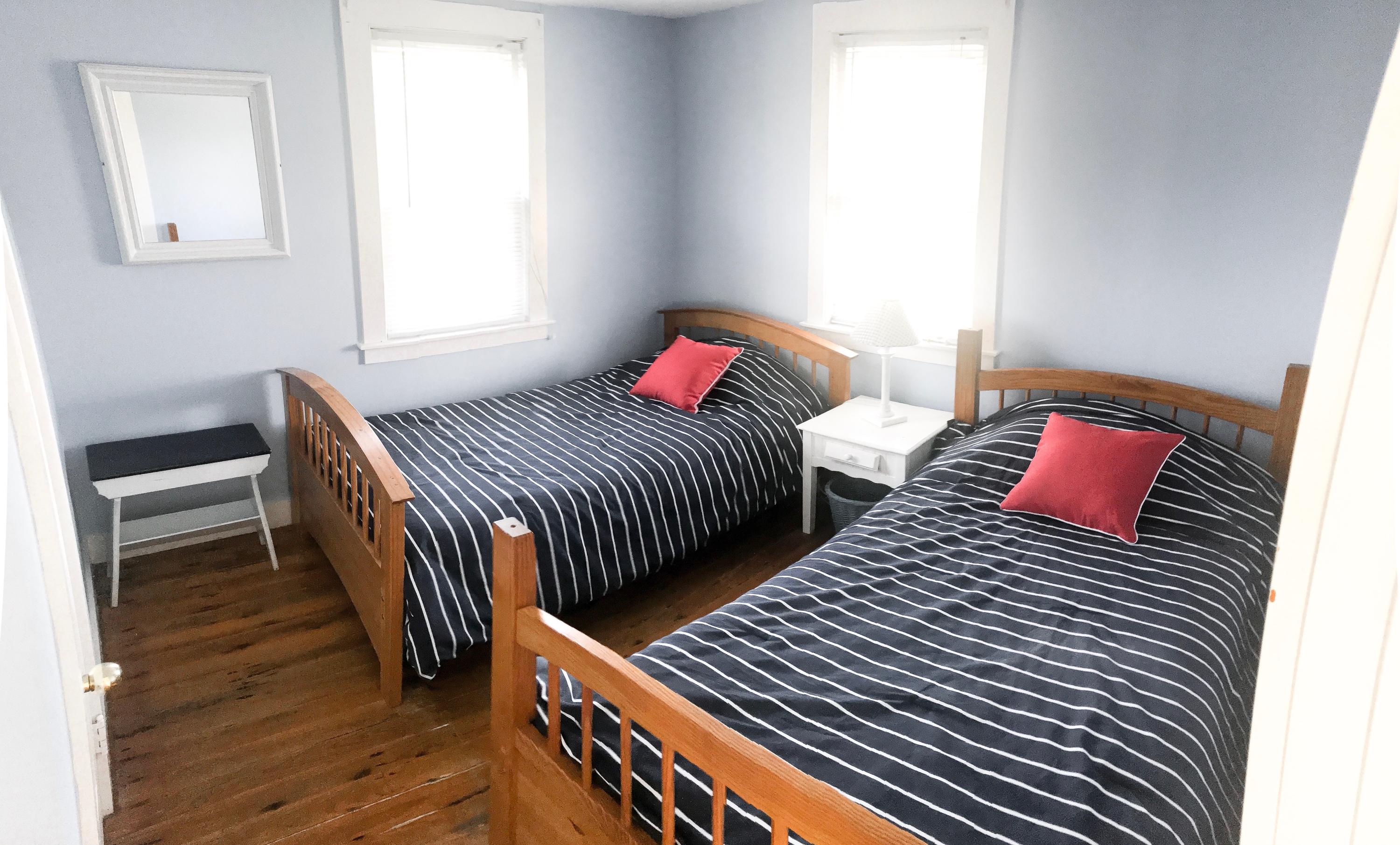 4 Beach Road West Dennis, MA 02670 - Photo 10 of 22 a bedroom with two beds and a window