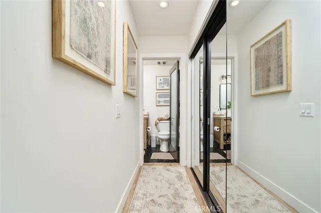 a bathroom with a granite countertop shower and a sink