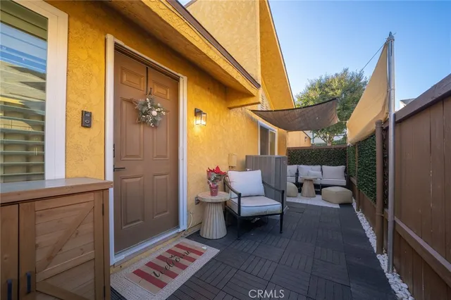 a living room with furniture or couch and a chandelier