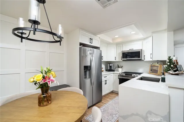 a kitchen with a stove and a sink