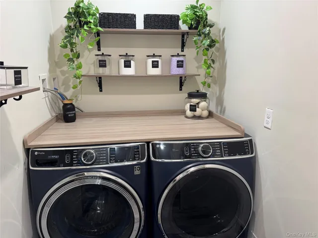 a utility room with dryer and washer