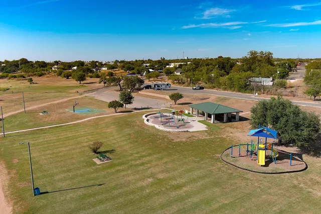 a view of a swimming pool with a table and chairs
