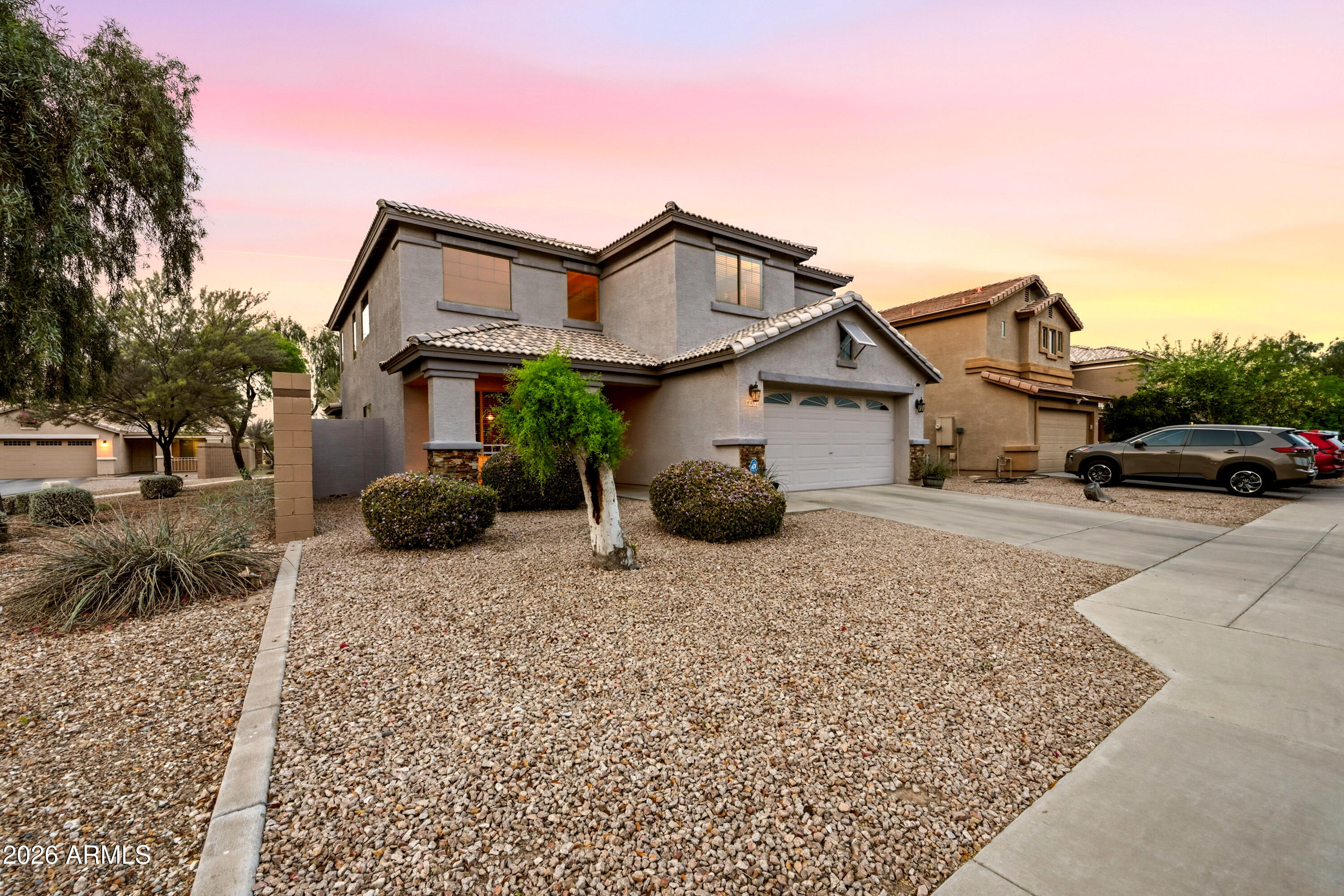 4372 West Alta Vista Road Laveen, AZ 85339 - Photo 2 of 47 a front view of a house with a yard