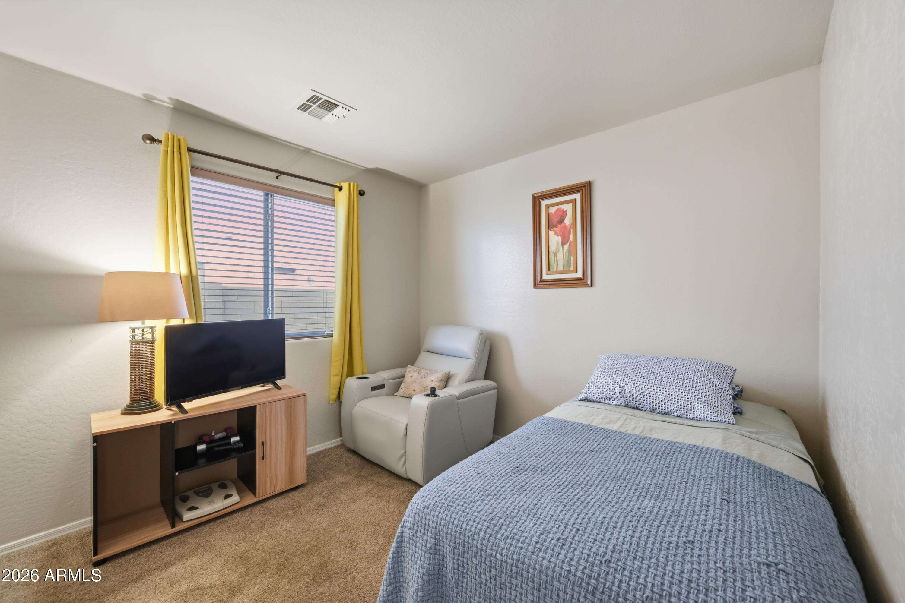 4372 West Alta Vista Road Laveen, AZ 85339 - Photo 23 of 47 a bedroom with two bed and a flat screen tv