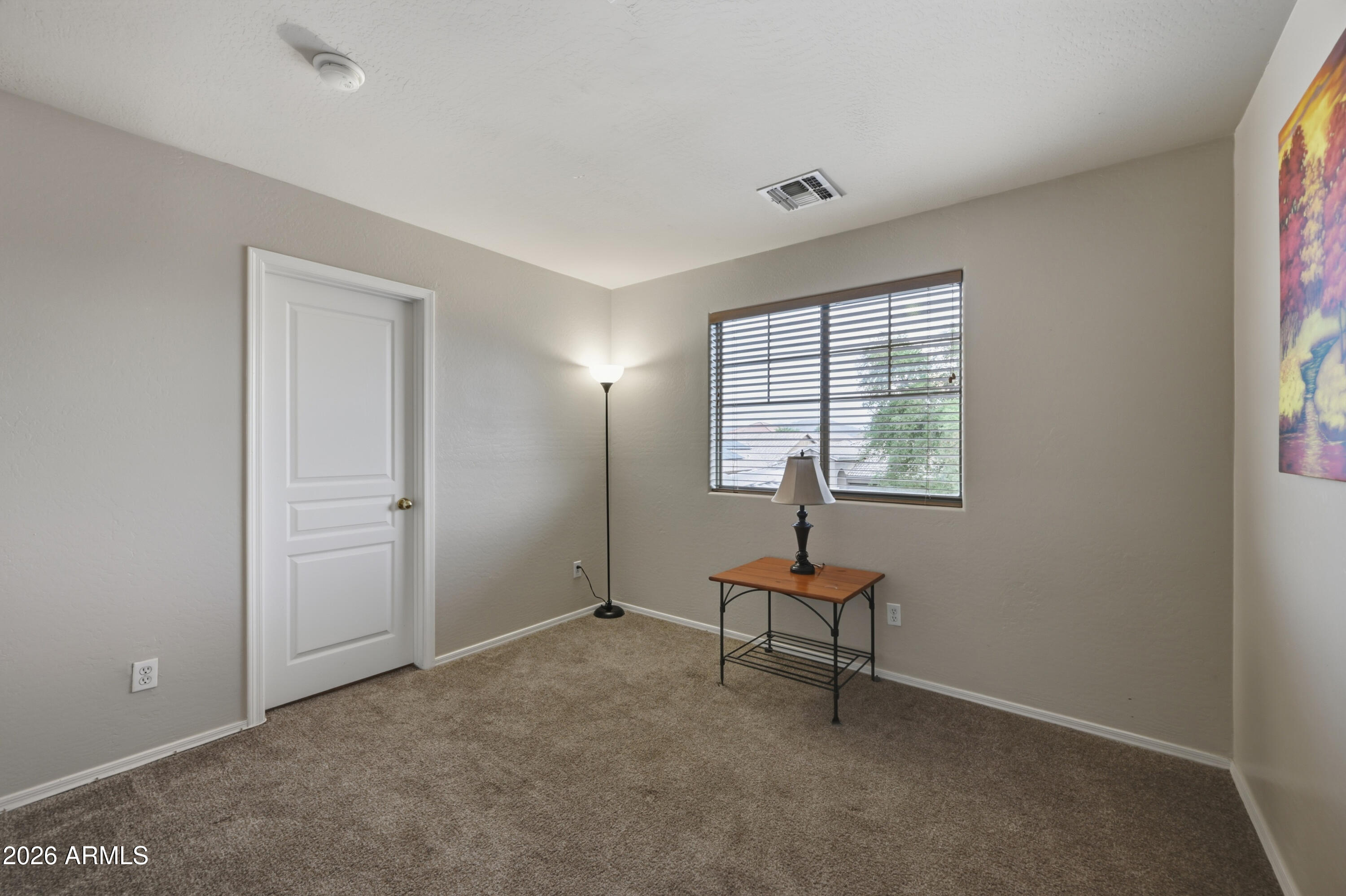 4372 West Alta Vista Road Laveen, AZ 85339 - Photo 25 of 47 a living room with furniture and a window