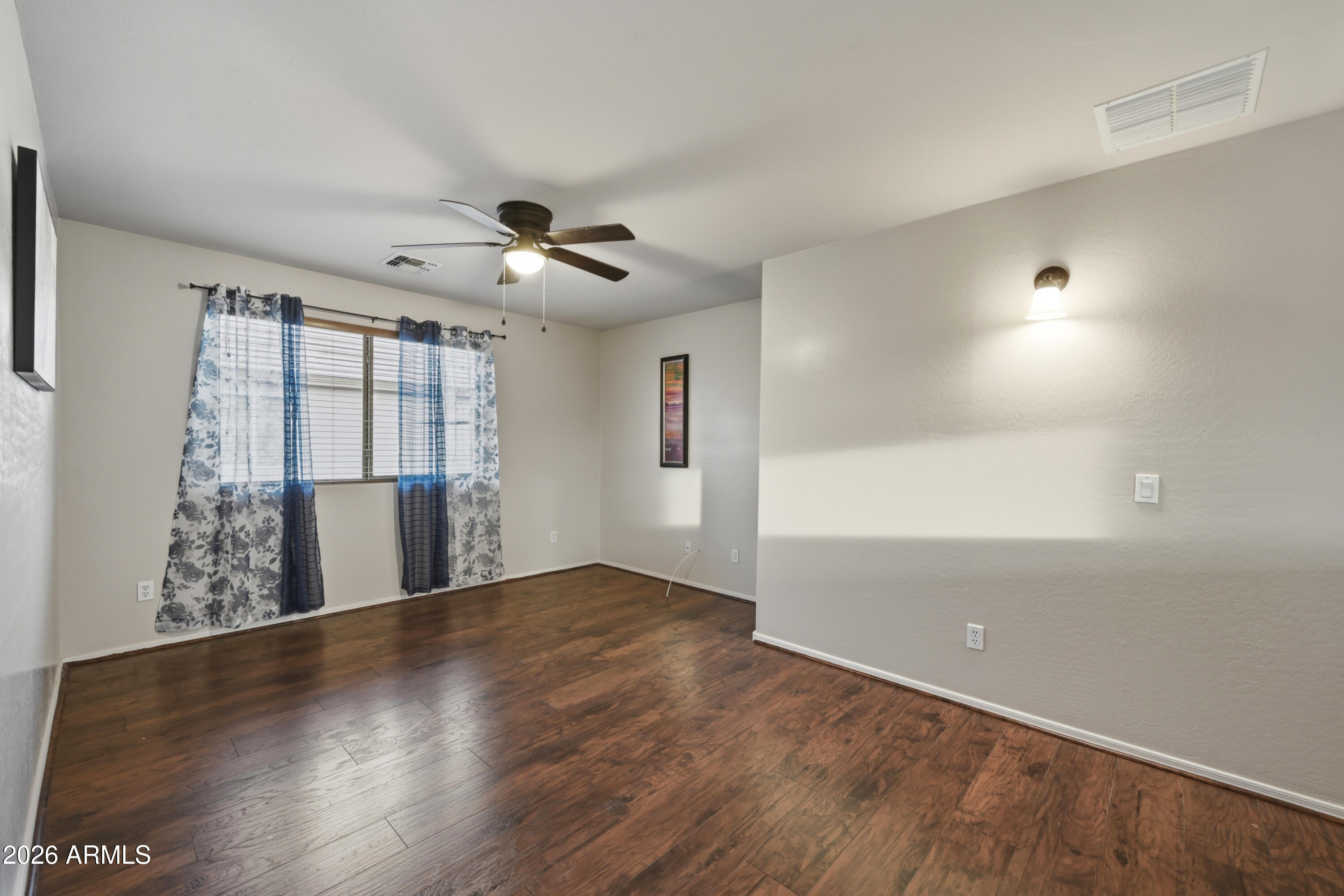 4372 West Alta Vista Road Laveen, AZ 85339 - Photo 28 of 47 wooden floor in an empty room with a window