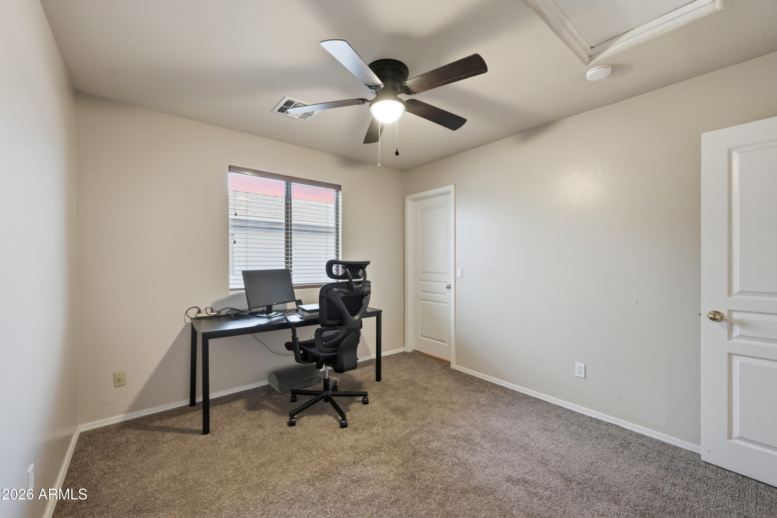 4372 West Alta Vista Road Laveen, AZ 85339 - Photo 30 of 47 a workspace with chandelier and a window