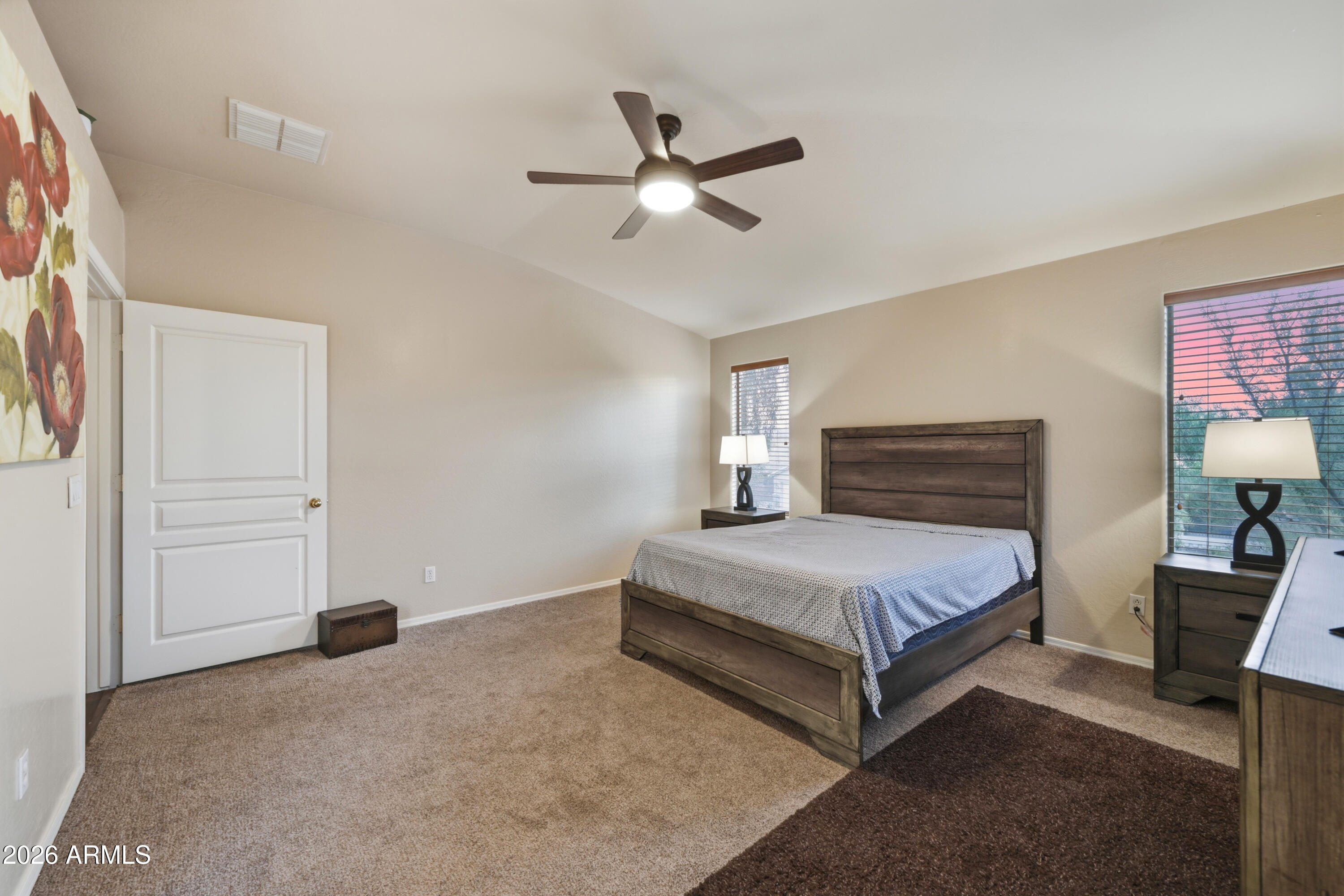 4372 West Alta Vista Road Laveen, AZ 85339 - Photo 32 of 47 a spacious bedroom with a bed and dresser