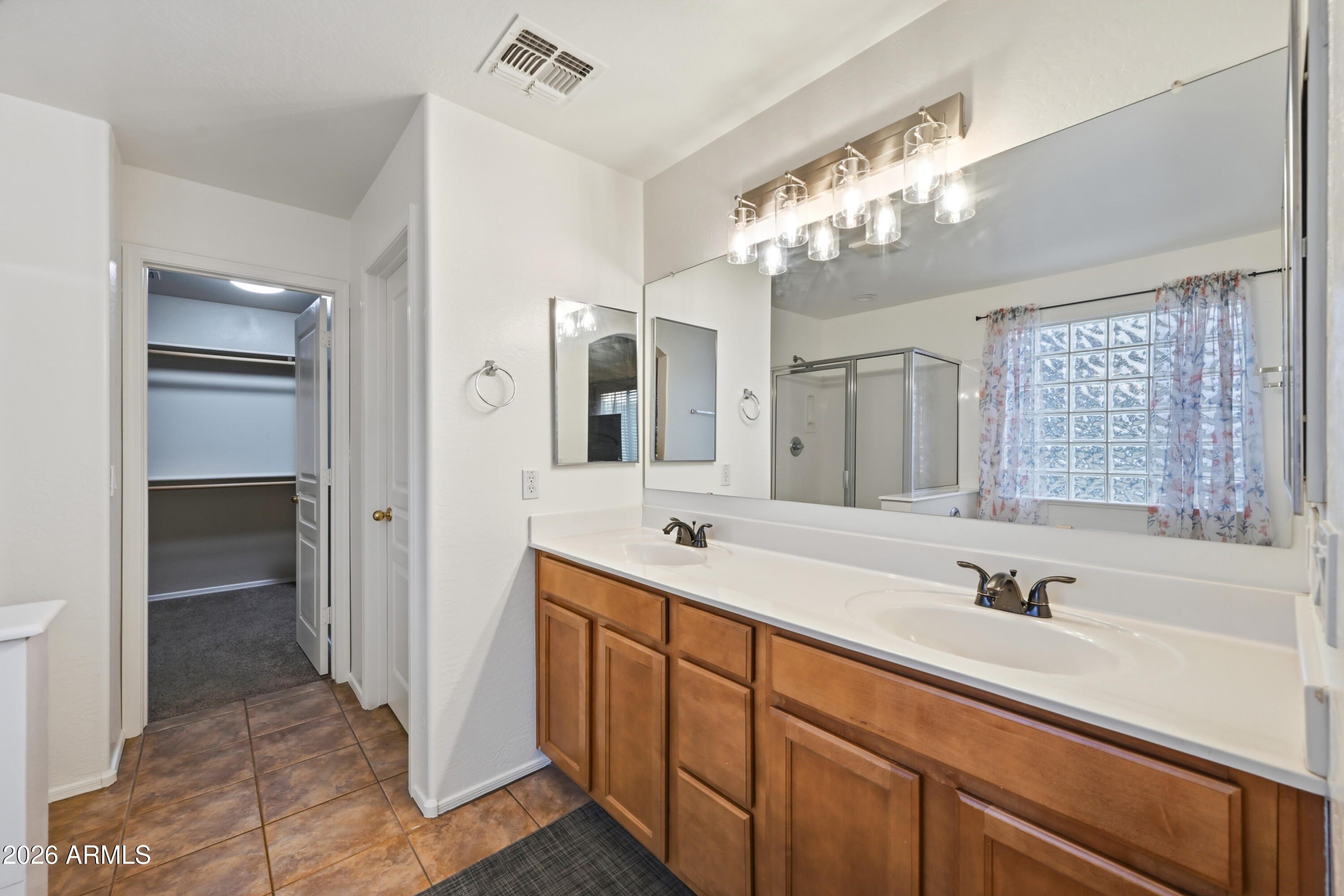 4372 West Alta Vista Road Laveen, AZ 85339 - Photo 34 of 47 a bathroom with a sink double vanity granite tub and a mirror