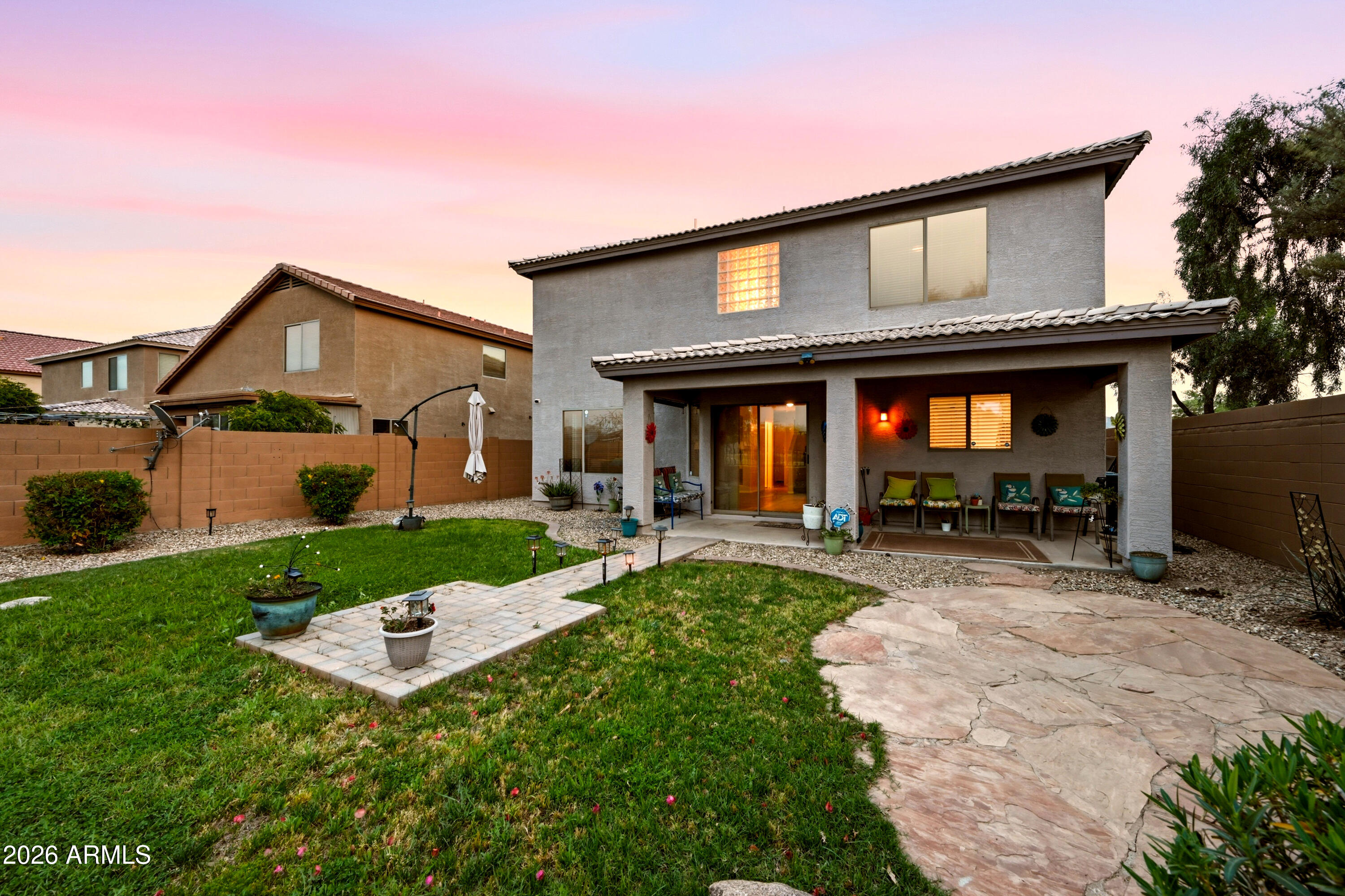 4372 West Alta Vista Road Laveen, AZ 85339 - Photo 4 of 47 a front view of a house with porch and a yard